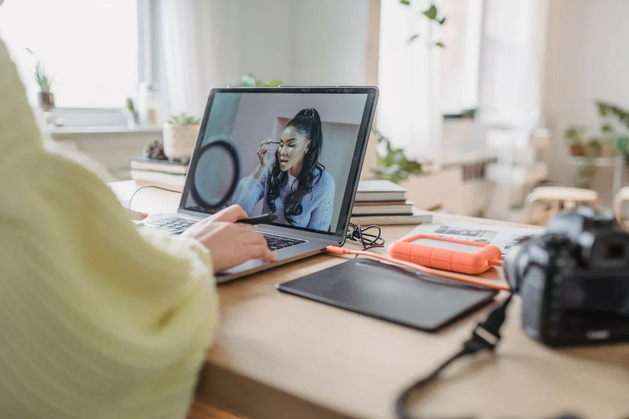 A creator editing visual content at a desk